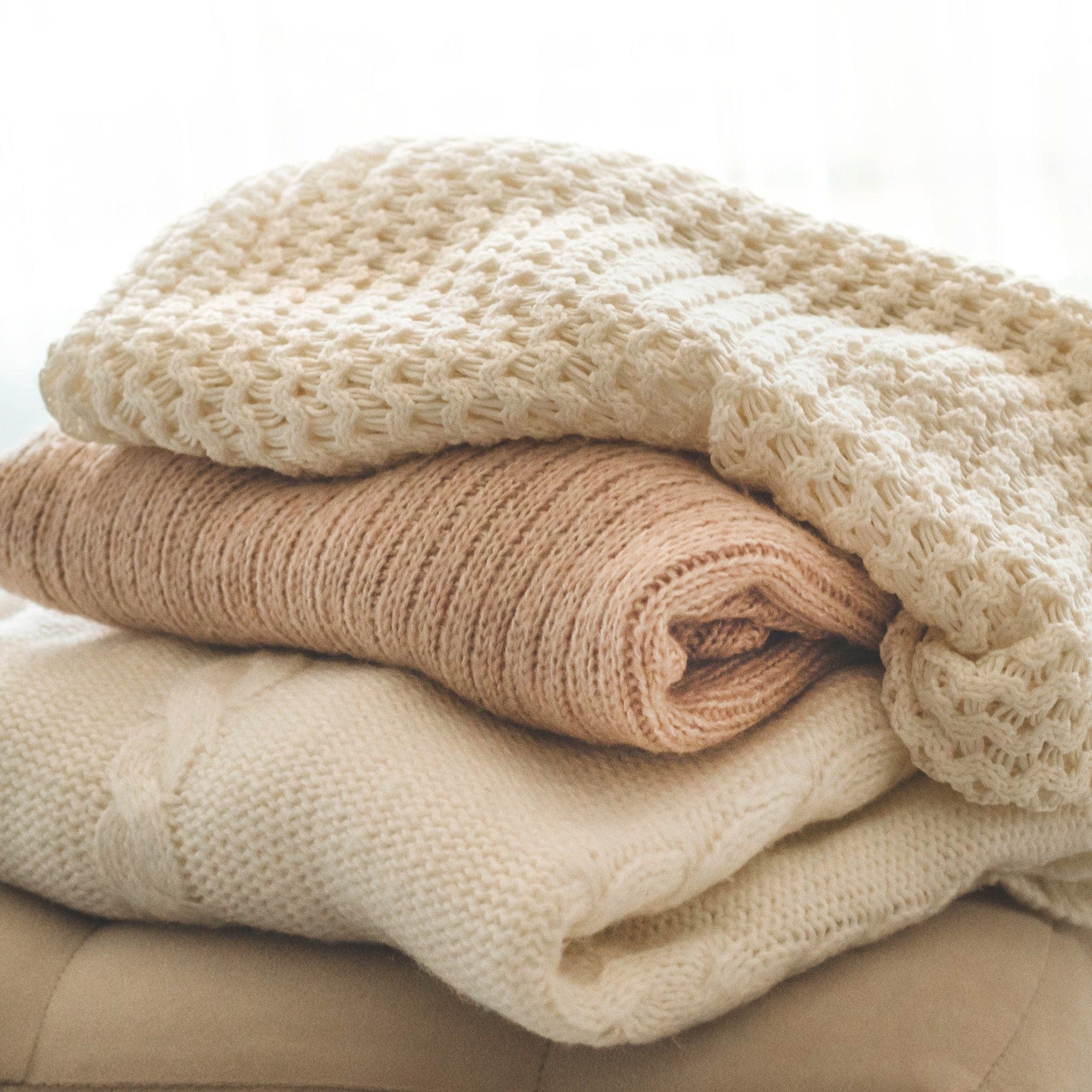 A stack of knitted sweaters in the interior of the living room